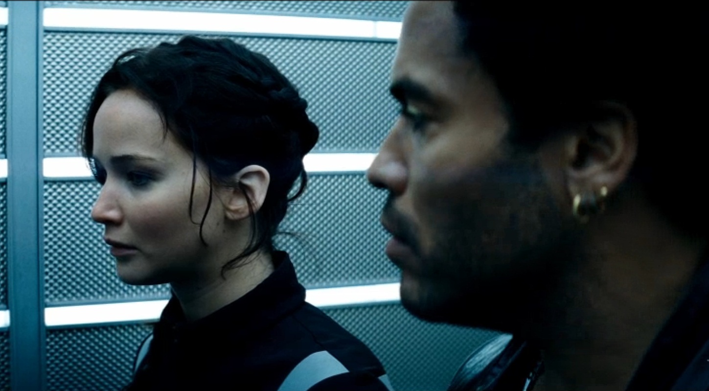 Jennifer Lawrence and Lenny Kravitz in Hunger Games: Catching Fire