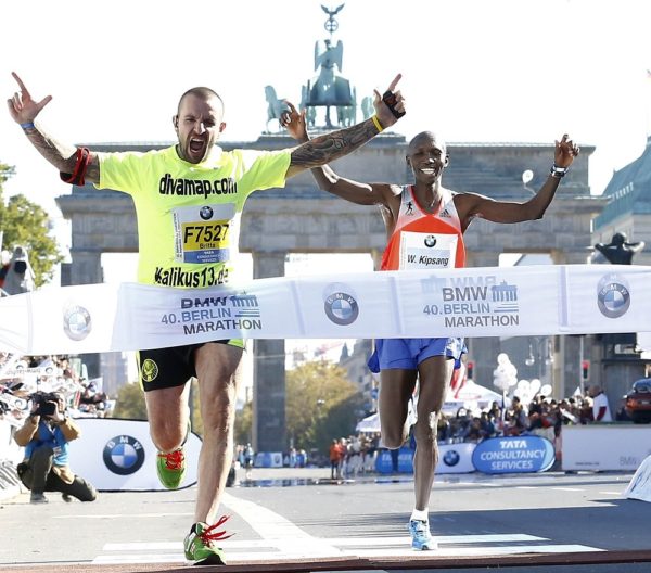 Kipsang of Kenya crosses finish line behind disrupter at 40th Berlin marathon