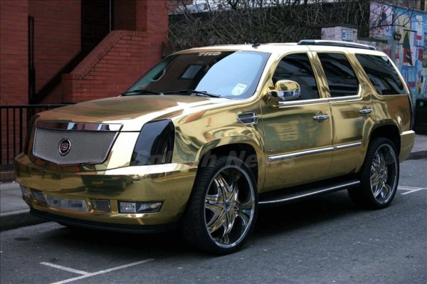 El Hadji Diouf of Blackburn Rovers' Gold Cadillac Escalade parked in Manchester city centre