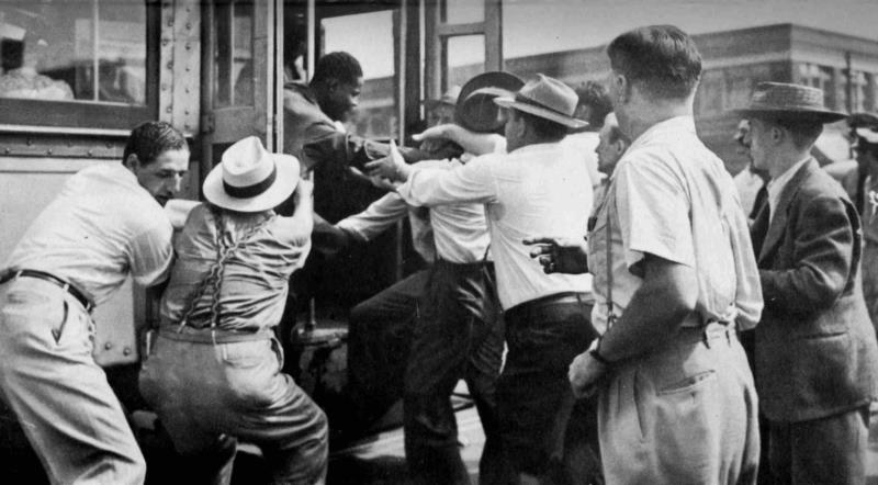 http://atlantablackstar.com/wp-content/uploads/2013/12/A-white-mob-attempts-to-abduct-a-black-man.jpg