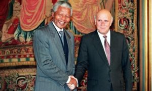Nelson Mandela and FW de Klerk shake hands in 1993.