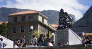 Colonizer Cecil John Rhodes is covered in plastic bags last month as part of a protest by students of the University of Cape Town. Photograph: Rodger Bosch/ AFP/Getty