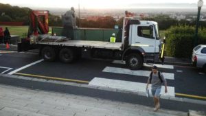 Taxi prepares to carry away Rhodes statue