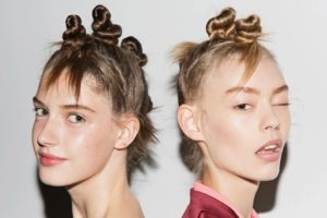 As the weather warms, we’ve got to think of creative ways to get our hair up and off our faces while still looking cool and chic! That’s why the twisted mini buns inspired by Guido Palau‘s from the Marc by Marc Jacobs SS15 show proves to be the perfect spring/summer hairstyle. Pair it with bold lipstick for a night out, tribal inspired makeup for a summer festival, or with dewy makeup for a rooftop BBQ. Source: ManeAddict.com