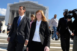 Abigail Fisher and Edward Blum walk outside the Supreme Court in October 2012. (Susan Walsh/AP Photo)