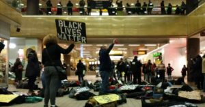 On the six month anniversary of his death, protesters staged a four-minute die-in at Grand Central Station in New York City on Monday, February 9, 2015 to honor Mike Brown, an unarmed black teenager, who was killed in Ferguson, Missouri by police. (Photo: @KeeganNYC/Twitter)