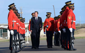 Prime Minister David Cameron inspects a Guard of Honour as he arrives at the airport in Kingston, Jamaica Photo: Photo: Stefan Rousseau/PA Wire