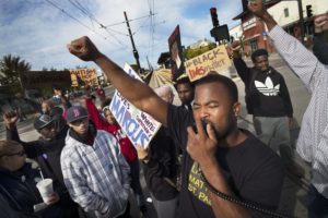 Near the Lexington light rail station in St. Paul, protesters with Black Lives Matters blocked traffic to and from TCF Stadium on the home opener for the Vikings. Organizer Rashad Turner, front, led the event. RICHARD TSONG-TAATARII – STAR TRIBUNE