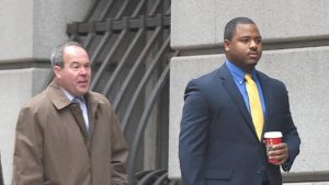 Officer William Porter arrives in Baltimore court for the first day of trials in the Freddie Gray case.