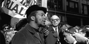 At a rally outside the U.S. Courthouse October 29, 1969, Dr. Benjamin Spock, background, listens to Fred Hampton, chairman of the Illinois Black Panther party. It was part of a protest against the trial of eight persons accused of conspiracy to cause a riot during the Democratic National Convention in 1968. (AP Photo/stf)