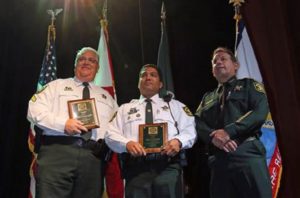 Gold Cross Award winners, from left, Sgt. Richard LaCerra and Deputy Peter Peraza stand with Sheriff Scott Israel during the Broward Sheriff’s Office Awards Ceremony at the African-American Research Library in Fort Lauderdale in 2013. Amy Beth Bennett / Sun Sentinel