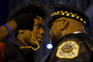Protesters confront Chicago police during a Nov. 25 demonstration in response to the fatal shooting of Laquan McDonald. (Andrew Nelles/Reuters)