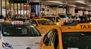 Taxis pass through the central terminal area of Los Angeles International Airport. (Irfan Khan / Los Angeles Times)