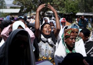 Women mourn during the funeral ceremony of a primary school teacher who family members said was shot dead by military forces during protests in Oromia, Ethiopia in December 2015. (Reuters)