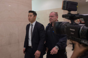 Officer Peter Liang exiting court this afternoon. He is charged with manslaughter and other offenses in the death of Akai Gurley. (Bryan R. Smith/ The New York Times)