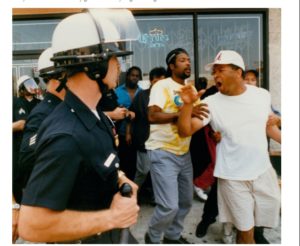 An argument between police and civilians preceding a rock- and brick-throwing incident at the corner of Vermont Avenue and 1st Street in Los Angeles on April 30, 1992. (Kirk McKoy / Los Angeles Times) 