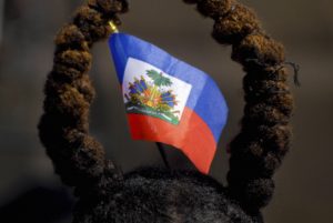 A Haitian flag worn by a spectator to symbolize the anniversary of the Battle of Vertire.