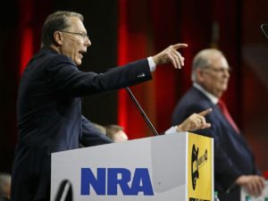 Wayne LaPierre, left, executive vice president of the National Rifle Association, speaks during the annual NRA convening. (AP Photo/Mark Humphrey)