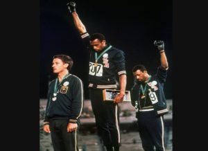 Gold medallist Tommie Smith (center) and bronze medalist John Carlos (right) 17 1968 Summer Olympics