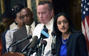 Principal Deputy Assistant Attorney General Vanita Gupta, right, speaks during a news conference as Police Commissioner Kevin Davis, second from right, and City Council president Bernard C. Jack Young listen at City Hall in response to a Justice Department report, Wednesday, Aug. 10, 2016 in Baltimore. The Justice Department and Baltimore police agreed to negotiate court-enforceable reforms after a scathing federal report released Wednesday criticized officers for using excessive force and routinely discriminating against blacks. [Kim Hairston/The Baltimore Sun via AP)