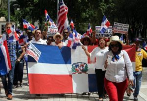 Marchers leave the Consulate General of Dominican Republic at 1038 Brickell Ave. and walk toward the General Consulate of The Republic of Haiti at 259 SW 13th St. on Wednesday, Aug. 19, 2015.