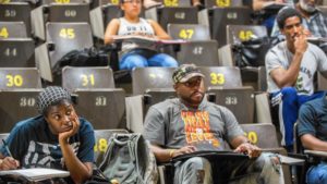 Student Nature Lawrence, 29, left, listens to a lecture by Dr. Kelly Harris, a professor of African-American studies at Chicago State University on Friday, Sept.2, 2016. (Zbigniew Bzdak/Chicago Tribune)
