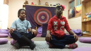 Robert W. Coleman Elementary School students practicing meditation in the Mindful Moment Room. Image courtesy of the Holistic Life Foundation.