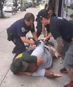 Video snapshot of Officer Daniel Pantaleo placing Eric Garner in a choke hold. Image courtesy iof the New York Daily News. 