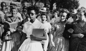 06 Sep 1957, Little Rock, Arkansas, USA --- Elizabeth Eckford ignores the hostile screams and stares of fellow students on her first day of school. She was one of the nine negro students whose integration into Little Rock's Central High School was ordered by a Federal Court following legal action by NAACP. --- Image by © Bettmann/CORBIS