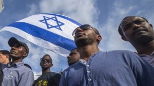 Israelis take part in a demonstration in Tel Aviv called by members of the Ethiopian community against alleged police brutality and institutionalized discrimination, on May 3, 2015. IMAGE: AFP PHOTO/JACK GUEZ (PHOTO CREDIT SHOULD READ JACK GUEZ/AFP/GETTY IMAGES)