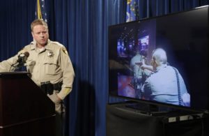 Las Vegas police Undersheriff Kevin McMahill watches body camera footage 