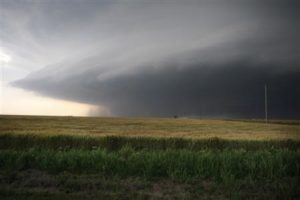 A large storm cell, which reportedly produced a multiple vortex tornado, passes south of El Reno, Oklahoma