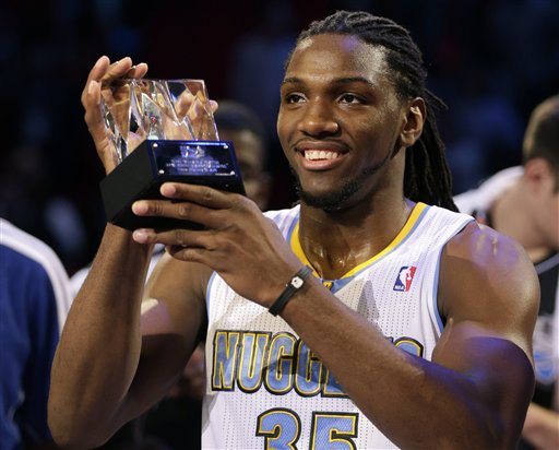 Kenneth Faried, of the Denver Nuggets, holds the MVP trophy after the Rising Stars Challenge basketball game at NBA All-Star Weekend, Friday, Feb. 15, 2013, in Houston. (AP Photo/Eric Gay)