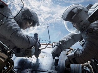 Sandra Bullock as Dr. Ryan Stone and George Clooney as Matt Kowalsky in Gravity