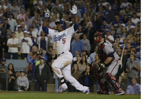 LOS ANGELES, CA, MONDAY, OCTOBER 7, 2013 - Juan Uribe hits a two run homer in the eighth inning to give the Dodgers a 4-3 lead in game four of the National League Division Series at Dodger Stadium. (Robert Gauthier / Los Angeles Times)