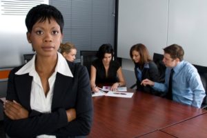 Multi-racial business team sitting around an office boardroom