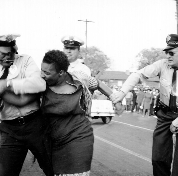 Woman resisting arrest Birmingham, Alabama, April 14, 1963