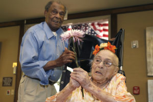 Gertrude Weaver, right, talks with her son Joe Weaver, Thursday, July 3, 2014 at Silver Oaks Health and Rehabilitation Center in Camden, Ark., a day before her 116th birthday.