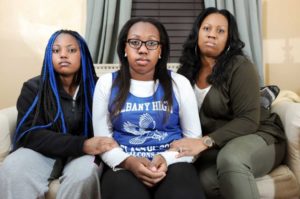 Kori Dobbs, 17, center, with her sister Camille Dobbs, 14, left, and their mother Selina Dobbs on Thursday, Nov. 20, 2014, at their home in Albany, N.Y. Kori was recently elected Senior Class President and has faced ugly, racist harassment on Twitter and social media. (Cindy Schultz / Times Union