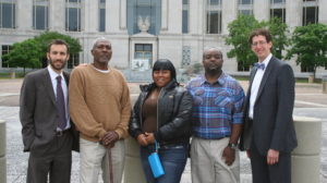 Sharnalle Mitchell (center) in Montgomery in May, after winning an injunction to stop the city from collecting court fines. With her (from left): attorney Alec Karakatsanis, fellow plaintiffs Lorenzo Brown and Tito Williams and attorney Matt Swerdlin.
