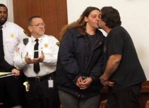Robert Snyder and Shayla Witts, who assaulted a MBTA employee, kiss before hearing.