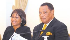 Prime Minister Perry Christie (right) and Cellular Liberalization Task Force Board Member Rowena Bethel during a press conference on Wednesday. Photo: Ahvia J. Campbell