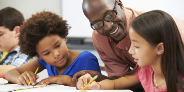 black male teacher smiling