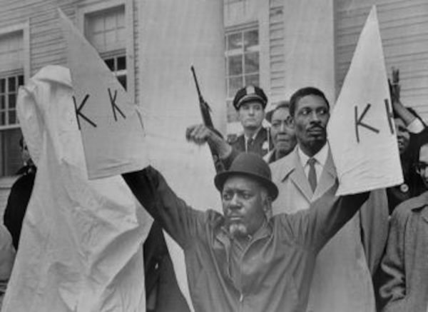 Charles Sims Holding Ku Klux Klan Clothing