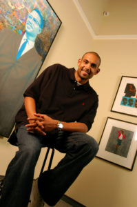 Grant Hill among some of his massive art collection.