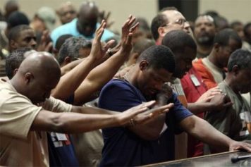 black men worshipping at church