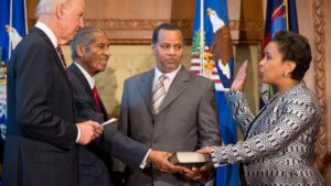 Loretta Lynch sworn in by Vice President Biden while her father Lorenza Lynch and husband Stephen Hargrove hold the Bible