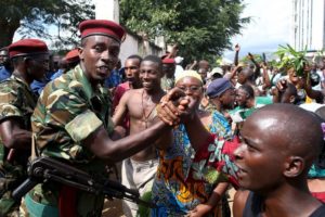 People greet soldiers as they celebrate in Bujumbura, after a general said he was dismissing President Pierre Nkurunziza for violating the constitution (Goran Tomasevic/Reuters)