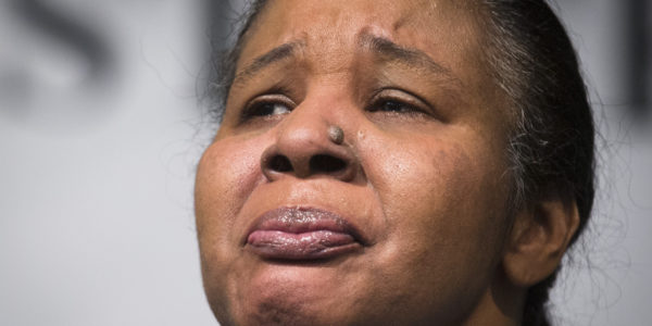 Esaw Garner, wife of Eric Garner, attends a news conference at the National Action Network headquarters in New York on Wednesday, Dec. 3, 2014 after a grand jury's decision not to indict a New York police officer involved in her husband's death. A video shot by an onlooker and widely viewed on the Internet showed the 43-year-old Garner telling a group of police officers to leave him alone as they tried to arrest him. The city medical examiner ruled Garner's death a homicide and found that a chokehold contributed to it. (AP Photo/John Minchillo)