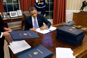 President Barack Obama signs legislation in the Oval Office, Dec. 22, 2010. (Official White House Photo by Pete Souza) 